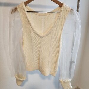 cream y white sweater vest